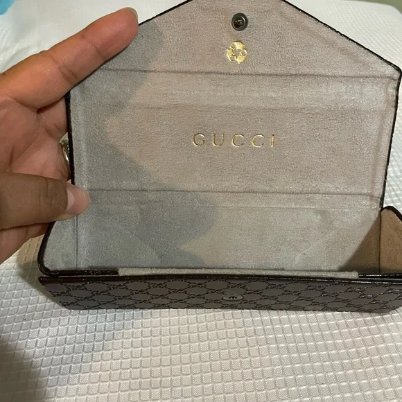brown leather monogrammed foldable eyeglasses case from Gucci. - Picture 16 of 16